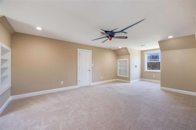 empty room featuring light carpet, recessed lighting, baseboards, and ceiling fan