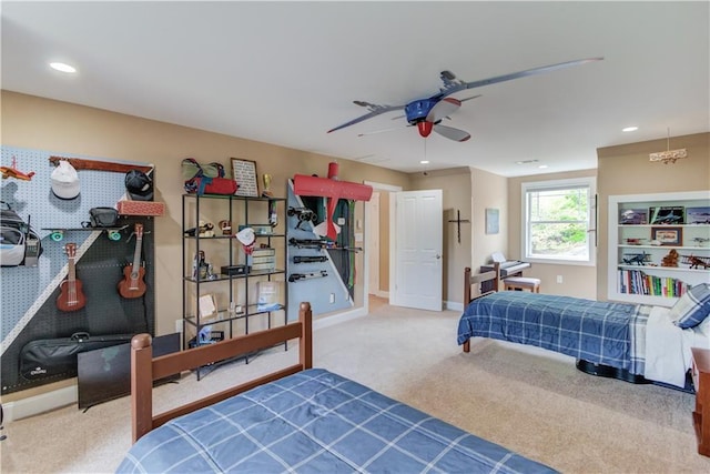 carpeted bedroom featuring baseboards, a ceiling fan, and recessed lighting