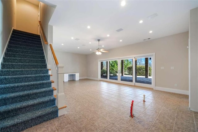 unfurnished living room featuring recessed lighting, stairway, baseboards, and a ceiling fan