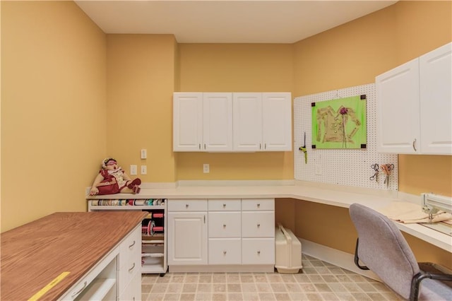 home office featuring built in study area