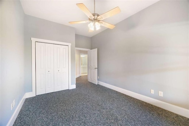 unfurnished bedroom with a closet, dark carpet, a ceiling fan, and baseboards