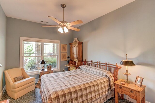 bedroom with visible vents, baseboards, a ceiling fan, and carpet flooring