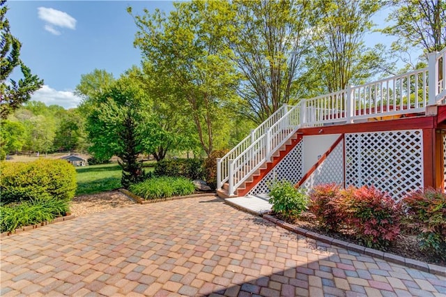 view of patio / terrace with a deck and stairway