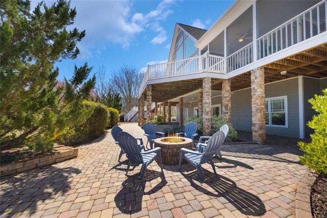 view of patio with a fire pit