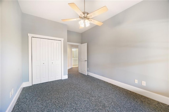 1126 Shoreline Dr, Jefferson, GA 30549 - unfurnished bedroom with dark colored carpet, baseboards, high vaulted ceiling, a closet, and ceiling fan