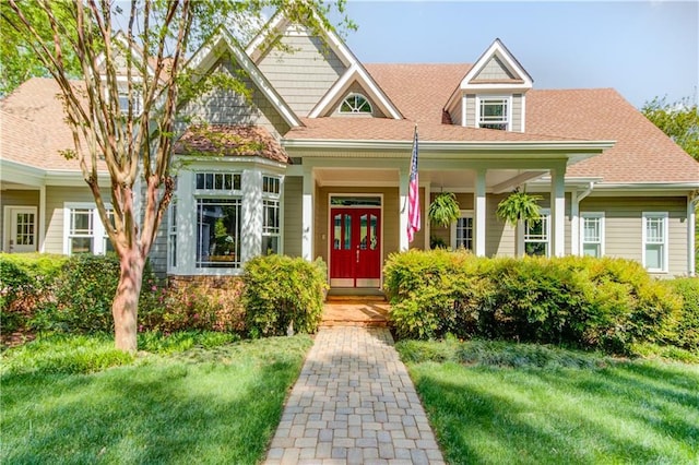 1126 Shoreline Dr, Jefferson, GA 30549 - craftsman-style house with a front yard, roof with shingles, and a porch