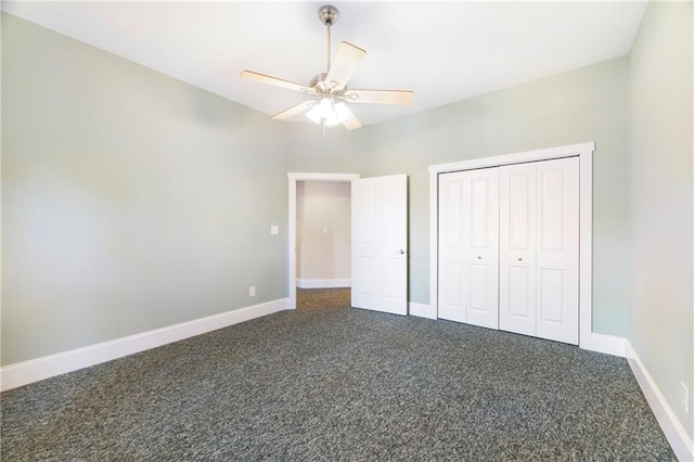 1126 Shoreline Dr, Jefferson, GA 30549 - unfurnished bedroom featuring dark carpet, baseboards, a closet, and a ceiling fan