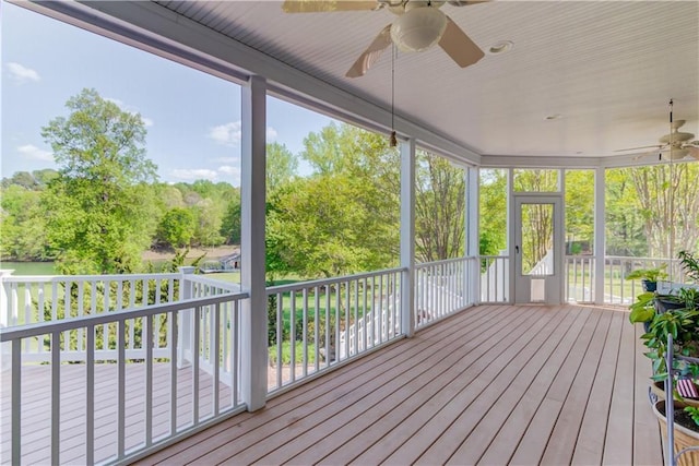 1126 Shoreline Dr, Jefferson, GA 30549 - unfurnished sunroom featuring ceiling fan and view of wooded area