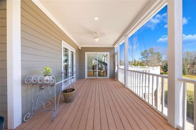 wooden terrace featuring ceiling fan