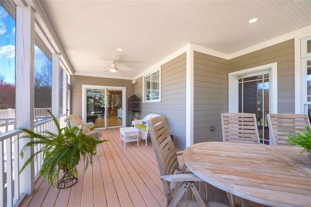 sunroom with a healthy amount of sunlight and ceiling fan