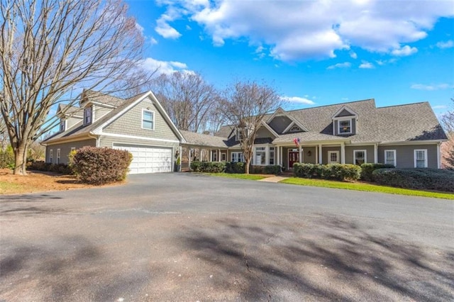 view of front of house featuring driveway and a garage