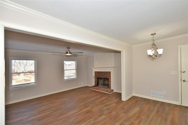 8310 Jensen Trl, Gainesville, GA 30506 - unfurnished living room with wood finished floors, ornamental molding, a brick fireplace, baseboards, and ceiling fan
