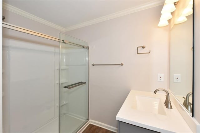 8310 Jensen Trl, Gainesville, GA 30506 - bathroom featuring vanity, a stall shower, crown molding, and wood finished floors