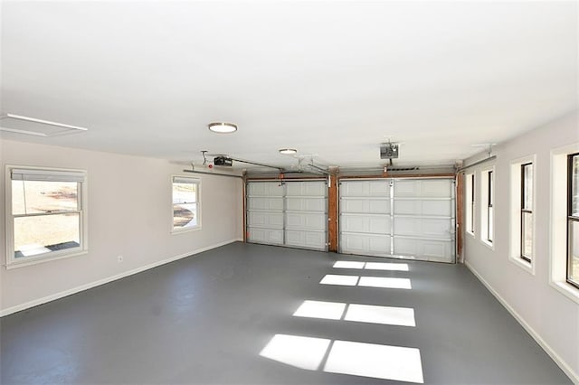 8310 Jensen Trl, Gainesville, GA 30506 - garage featuring baseboards and a garage door opener