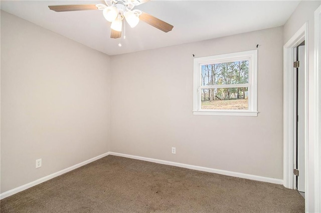 unfurnished room featuring ceiling fan and carpet floors