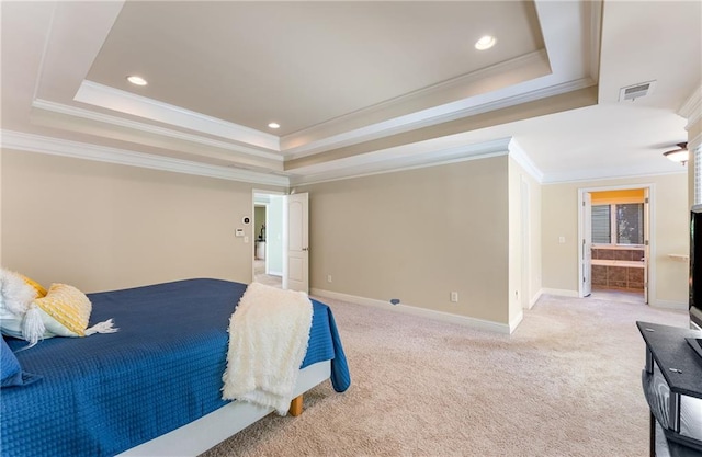 carpeted bedroom featuring ornamental molding and a raised ceiling