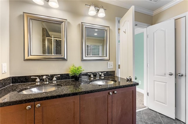 bathroom featuring vanity, crown molding, tile patterned floors, and a shower with door