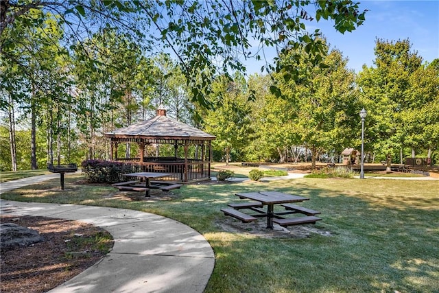 view of property's community with a gazebo and a lawn