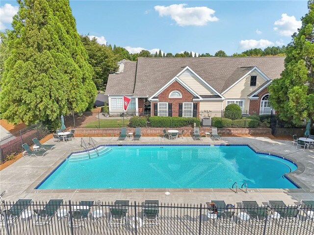 view of pool featuring a patio