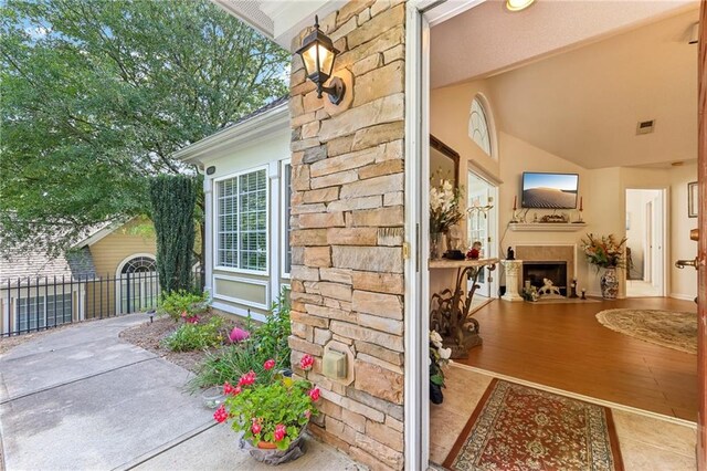 exterior space featuring an outdoor fireplace