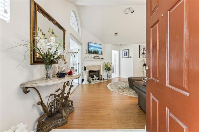 entryway with hardwood / wood-style flooring and a healthy amount of sunlight