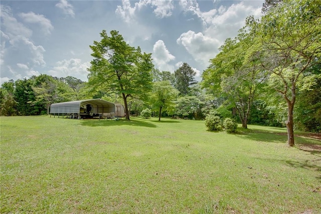 view of yard with a carport