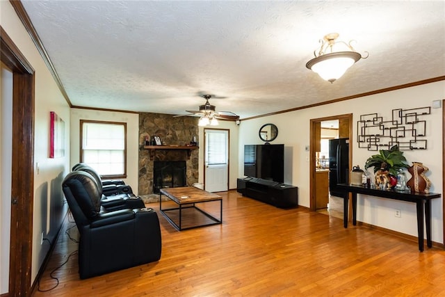 living room with ornamental molding and a textured ceiling