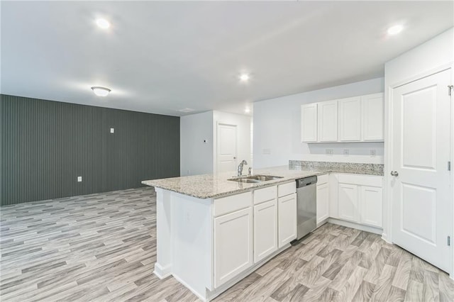 kitchen with white cabinetry, light wood-type flooring, sink, and dishwasher