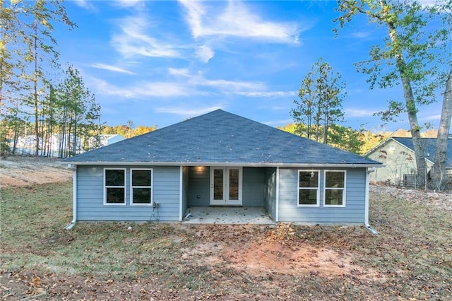 view of front of property with a patio and french doors