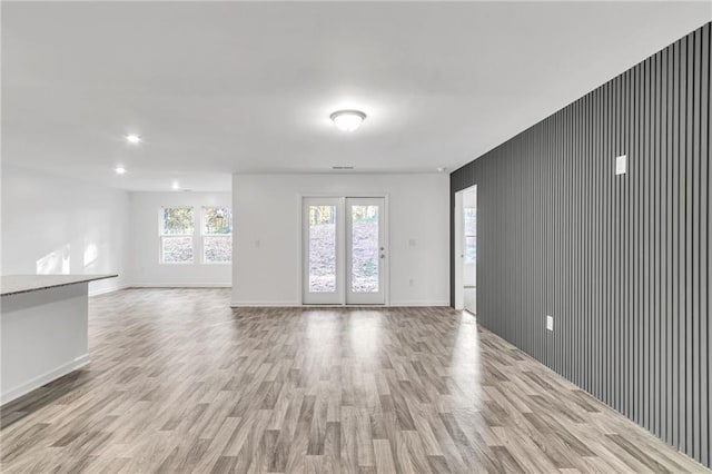 spare room with light hardwood / wood-style flooring