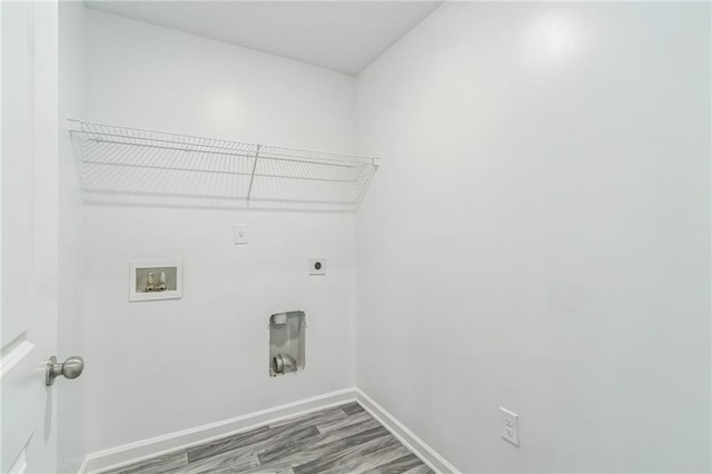 clothes washing area with hardwood / wood-style flooring, hookup for a washing machine, and electric dryer hookup