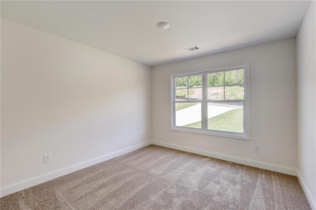 empty room with light colored carpet