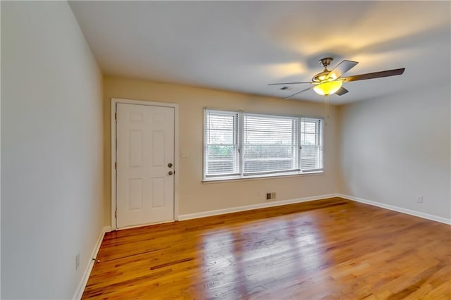 unfurnished room with ceiling fan and light hardwood / wood-style flooring