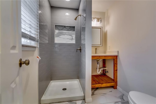 bathroom with tiled shower and toilet