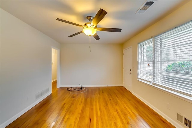 unfurnished room featuring ceiling fan and light wood-type flooring