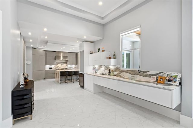 full bathroom with marble finish floor, recessed lighting, decorative backsplash, and vanity