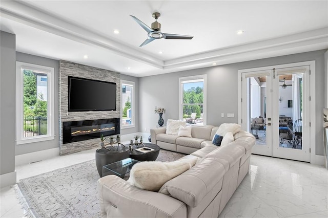 living room featuring recessed lighting, a fireplace, a ceiling fan, marble finish floor, and french doors