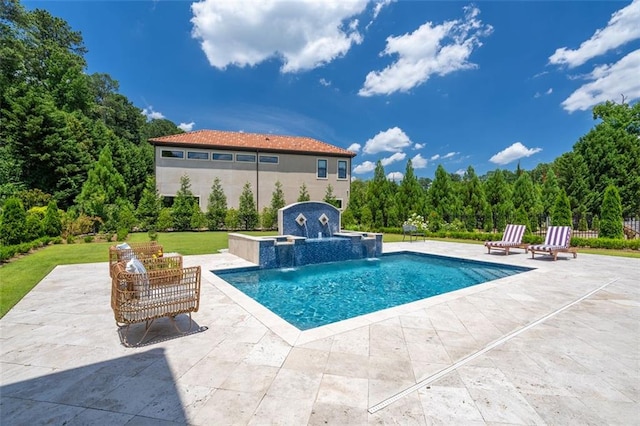 outdoor pool with a yard and a patio