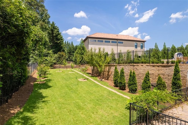 view of yard with a fenced backyard