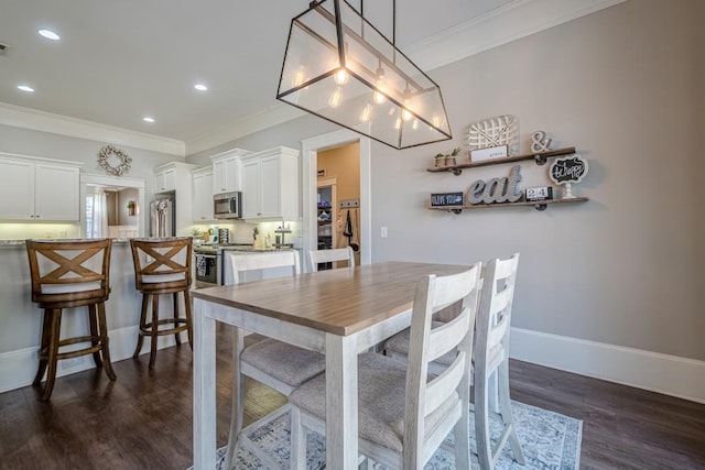 dining room with crown molding and dark wood-type flooring