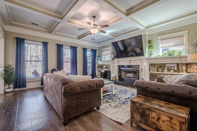 living room featuring beamed ceiling, ornamental molding, and coffered ceiling