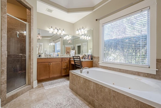 bathroom featuring vanity, tile patterned floors, and shower with separate bathtub