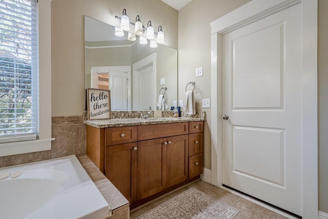 bathroom with tile patterned flooring and vanity