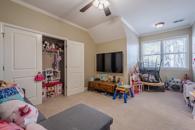 recreation room featuring ceiling fan, ornamental molding, vaulted ceiling, and light carpet