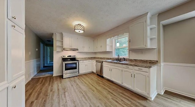 kitchen featuring a sink, extractor fan, stainless steel appliances, a textured ceiling, and open shelves
