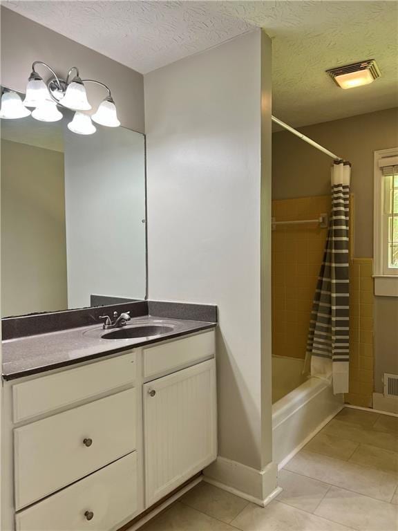 5607 Mountainbrooke Ct, Stone Mountain, GA 30087 - bathroom featuring tile patterned floors, vanity, shower / tub combo with curtain, a textured ceiling, and baseboards