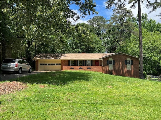 5607 Mountainbrooke Ct, Stone Mountain, GA 30087 - ranch-style home with an attached garage, a front yard, brick siding, and driveway