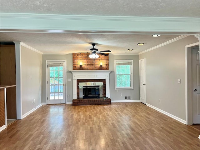 5607 Mountainbrooke Ct, Stone Mountain, GA 30087 - unfurnished living room with wood finished floors, a ceiling fan, a textured ceiling, plenty of natural light, and ornamental molding