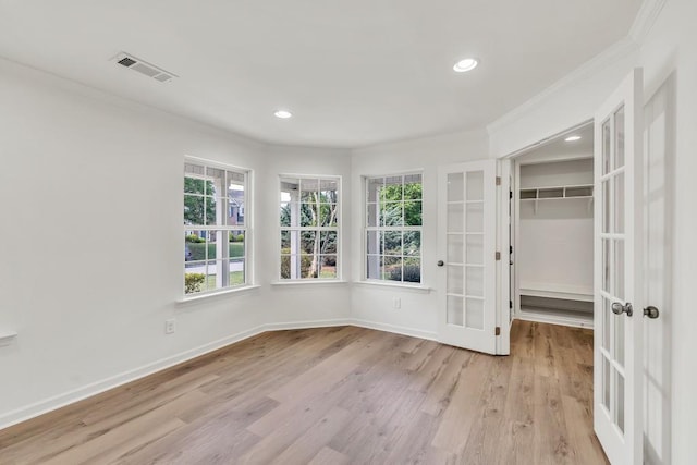 895 Roxfield Ct, Buford, GA 30518 - unfurnished room featuring ornamental molding, french doors, plenty of natural light, wood finished floors, and recessed lighting