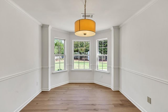 895 Roxfield Ct, Buford, GA 30518 - unfurnished dining area featuring ornamental molding, wood finished floors, and baseboards